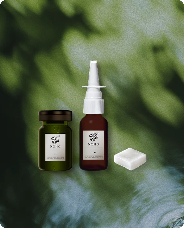 Glutathione vial and nasal spray on a green background